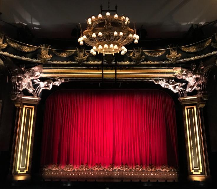 A Red Curtain With A Gold Curtain