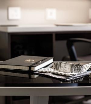 notebook and watch on a table