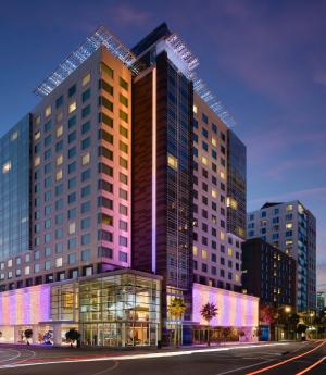 Exterior of LUMA Hotel San Francisco at dusk