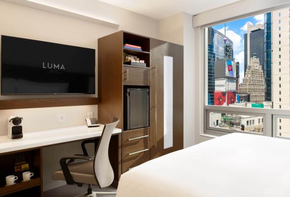 Desk and bed in guest room