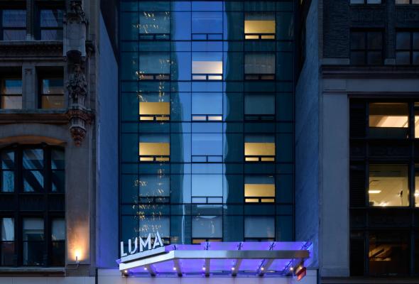 Exterior of LUMA Hotel Times Square at night