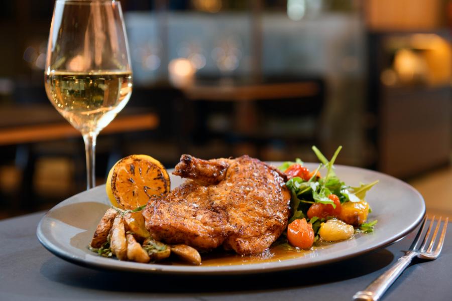 Roast chicken and glass of white wine