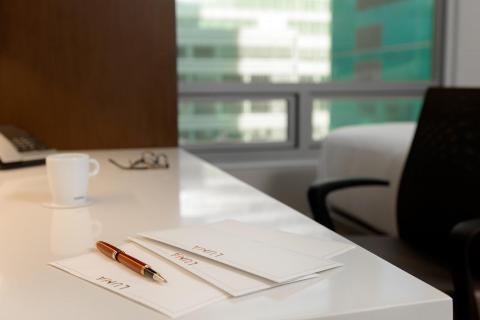 pen and paper on a desk