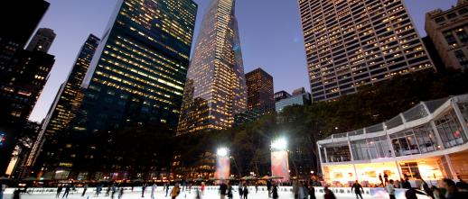 ice skaters in Bryant Park at night